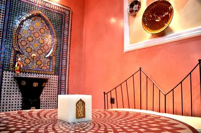 a room with a table with a candle on it at Luxury Riad Saad Fes- Apart in Fès