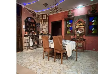 a dining room with a table and chairs at 