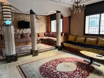 a living room with a couch and a table at 