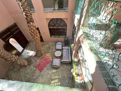 an overhead view of a balcony with a table and chairs at Dar Nakhla Zagora Guest House Restaurant & Desert Excursions in Zagora