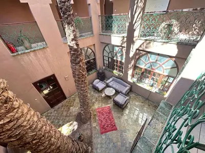 an overhead view of a building with a palm tree at Dar Nakhla Zagora Guest House Restaurant & Desert Excursions in Zagora