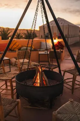 a fire pit with a fire at Royal Luxury Camp in Merzouga