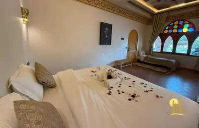 a bedroom with a bed covered in pet food at Sbai Palace in Mhamid