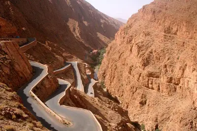 a winding road in a canyon in the desert at Riad Sephora in Tinerhir