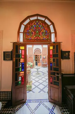 an open door with a stained glass window at Dar Dalila Fes in Fès