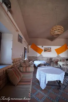 a living room with a couch and a table at Sahara Desert Experience camp in Merzouga