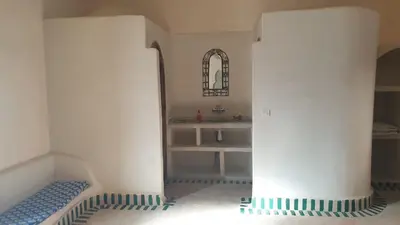 a toy room with a sink and a shelf at Kasbah Tamariste in Merzouga
