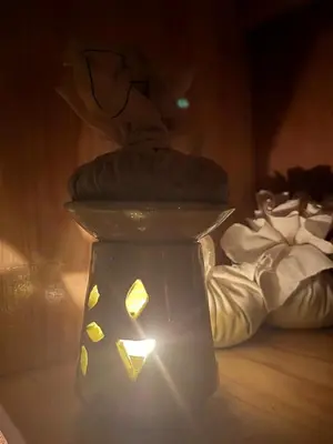 a vase with a hat on top of it at Kasbah La Cigogne in Aït Ben Haddou
