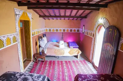 a bedroom with a bed in a room at Sky Luxury Camp in Mhamid