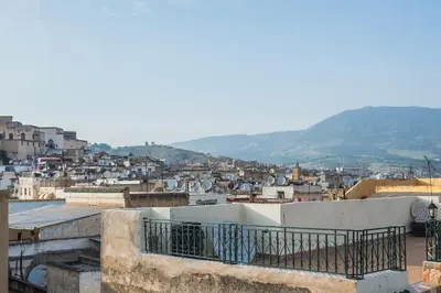 a view of a city from the roof of a building at Riad L'Artiste in Fès