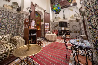 a living room with a couch and a table at Maison Famille Tazi in Fès