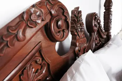 a close up of a wooden bed frame at Riad Alassala Fes in Fès