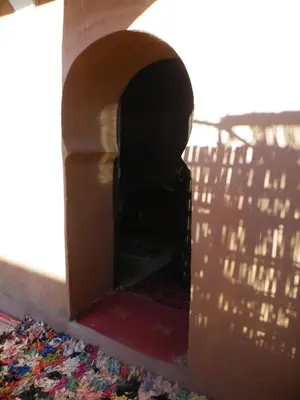 a dog house with a hole in the floor at Auberge L'Oasis in Foum Zguid