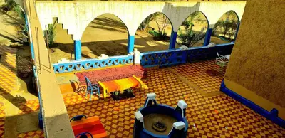 a lego model of a building with a table and chairs at Auberge Camping Ocean des dunes in Merzouga