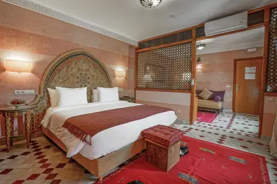 a bedroom with a large bed in a room at Algilà Fes Riad Medina Charme Hotel in Fès