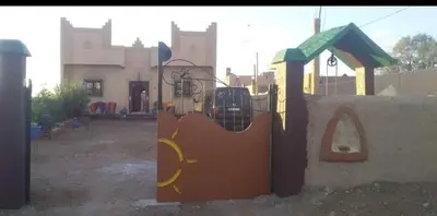 a childs play equipment in a playground at Maison Riad Tamarighte in Merzouga