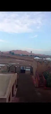 a view of an airport with mountains in the background at Maison Riad Tamarighte in Merzouga