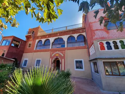 an old building with a lot of windows at Kasbah Chems in Kalaat MGouna