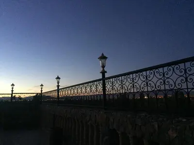 a fence with street lights on top of it at Dar nadia bendriss in Ouarzazate