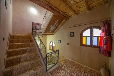 a stairway in a building with a window and a window at Dar nadia bendriss in Ouarzazate