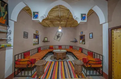 a large room with a table and chairs in it at Dar nadia bendriss in Ouarzazate