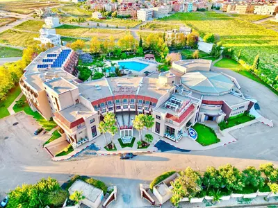 an aerial view of a large building with a pool at Hotel Menzeh Dalia in Meknès