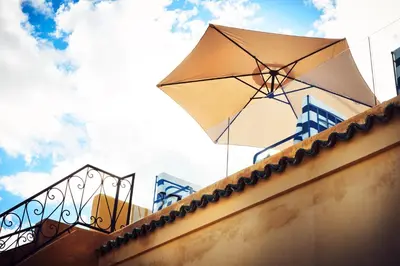 a large umbrella sitting on top of a building at Chaq Chaq in Fès