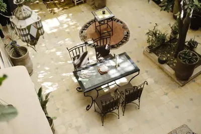 an overhead view of a table and chairs in a patio at Auberge Ayam Atlas- pool 10mn away in Ourika