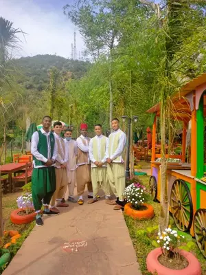 a group of men standing next to a train at ferme by Ikalimo in Ourika