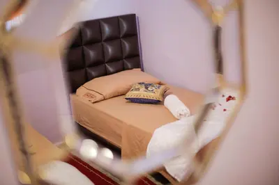 a reflection of a bed in a mirror at Dar Widad in Ouarzazate