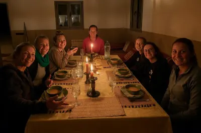 a group of people sitting around a table at Bivouac Luna in Mhamid