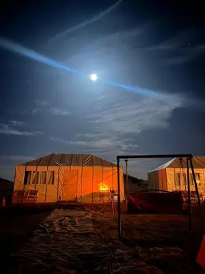 a large tent with the moon in the sky at Bivouac Luna in Mhamid