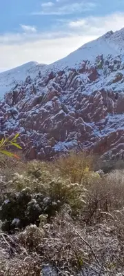 a mountain with snow on top of it at Auberge Restaurant Zahra in Boumalne