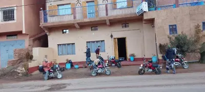 a group of motorcycles parked in front of a building at Auberge Restaurant Zahra in Boumalne