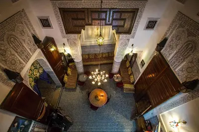 an overhead view of a building with a chandelier at Dar Lalla Kenza in Fès