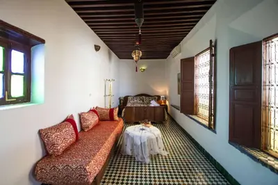 a living room with a couch and a table at Dar Lalla Kenza in Fès