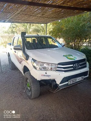 a white truck is parked under a roof at Authentique berber Camp & Activities in Mhamid
