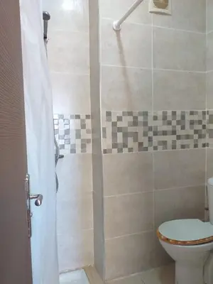 a bathroom with a shower with a toilet at Un havre de paix à Ifrane in Ifrane