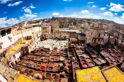 an aerial view of a city with cars parked at Moroccan Dream Hostel in Fès