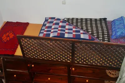a wooden dresser with pillows on top of it at Moroccan Dream Hostel in Fès