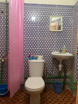 a bathroom with a toilet and a sink at Bab Al Madina in Fès