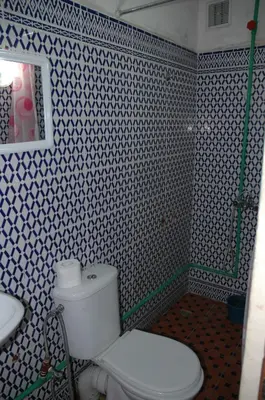 a bathroom with a toilet and a sink at Bab Al Madina in Fès
