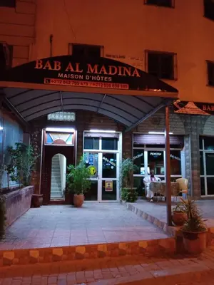 a restaurant with a sign that reads bar ale ale madinima mason divorce at Bab Al Madina in Fès