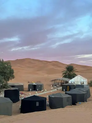 a group of tents in the desert at Sahara Bedouins Camp in Hassilabied