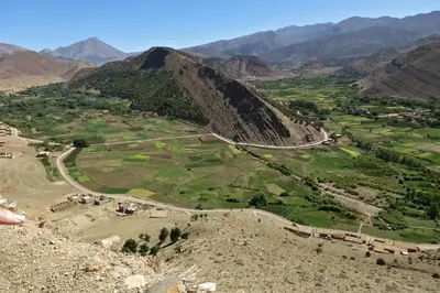an aerial view of a valley in the mountains at Dar Ait Bouguemez in Azilal