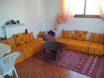 a living room with two couches and a table at Villa SALAM in Ifrane