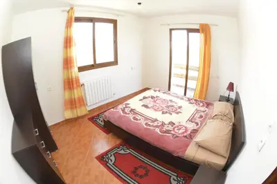 a small bedroom with a bed and a window at Villa SALAM in Ifrane