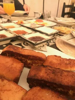 a table with a plate of bread on it at Tiziri Camp in Merzouga