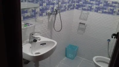 a bathroom with a sink and a toilet at Gite porte oasis in Er Rachidia