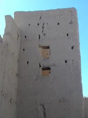 a white wall with some holes in it at Gite porte oasis in Er Rachidia